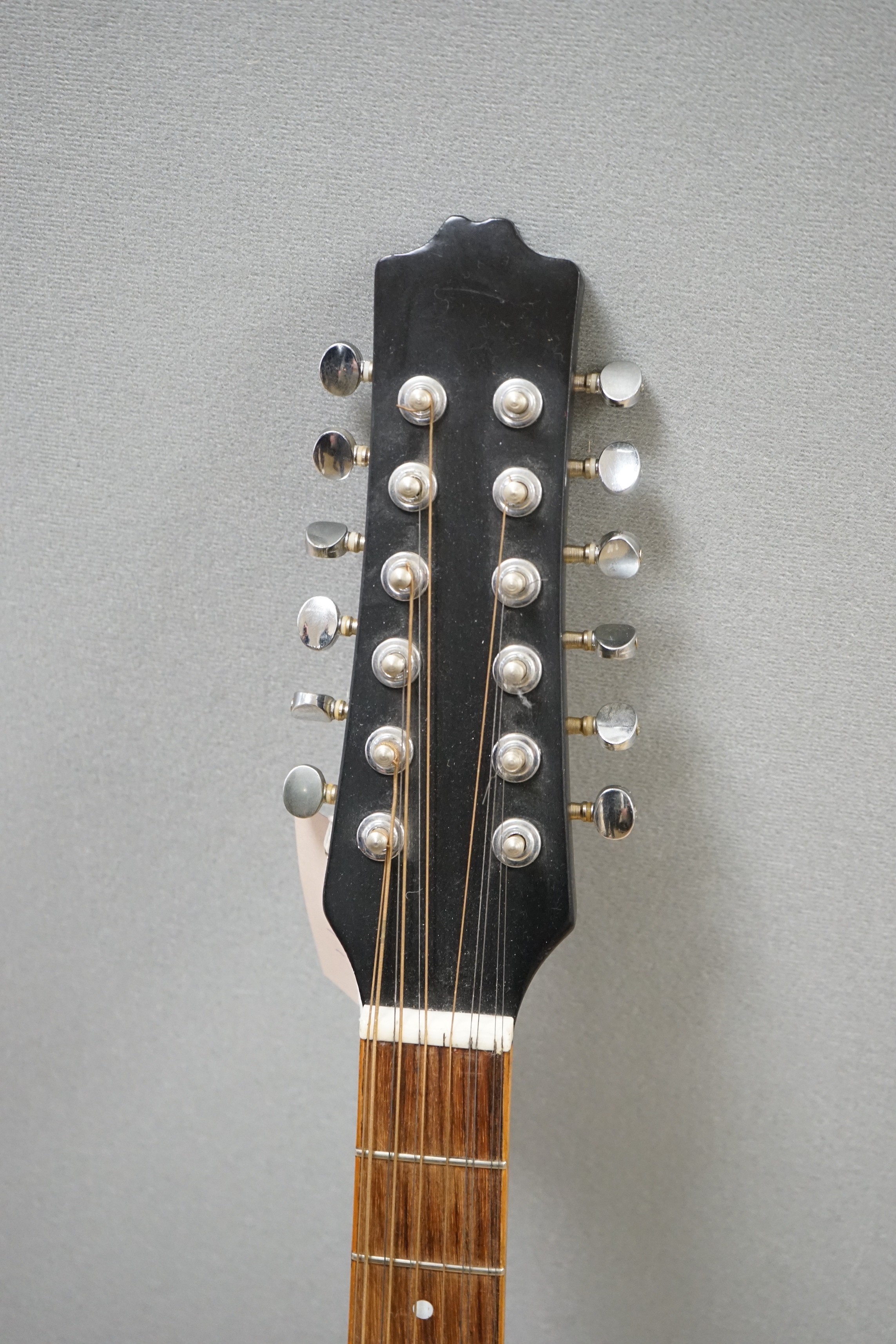 A 12 string acoustic guitar, unknown maker, repaired by John Degay of Degay Guitars